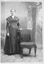 SA0046 - A full length studio portrait, Martha Anderson is standing by a chair., Winterthur Shaker Photograph and Post Card Collection 1851 to 1921c